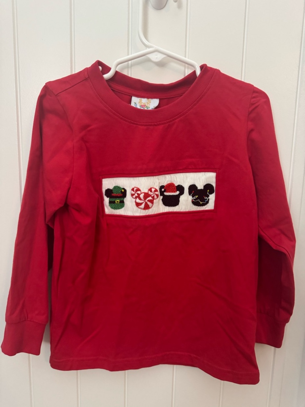 Kids long-sleeve shirt featuring smocked Disney characters 4T